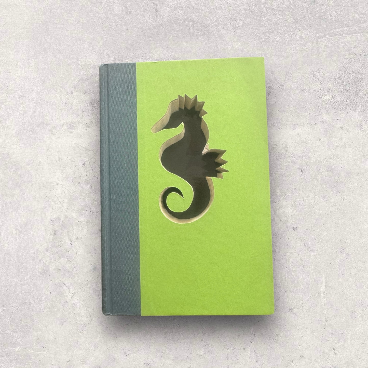 Seahorse cut out book decor