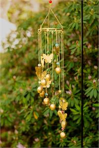 Wind chimes gold bells and butterflies and beads