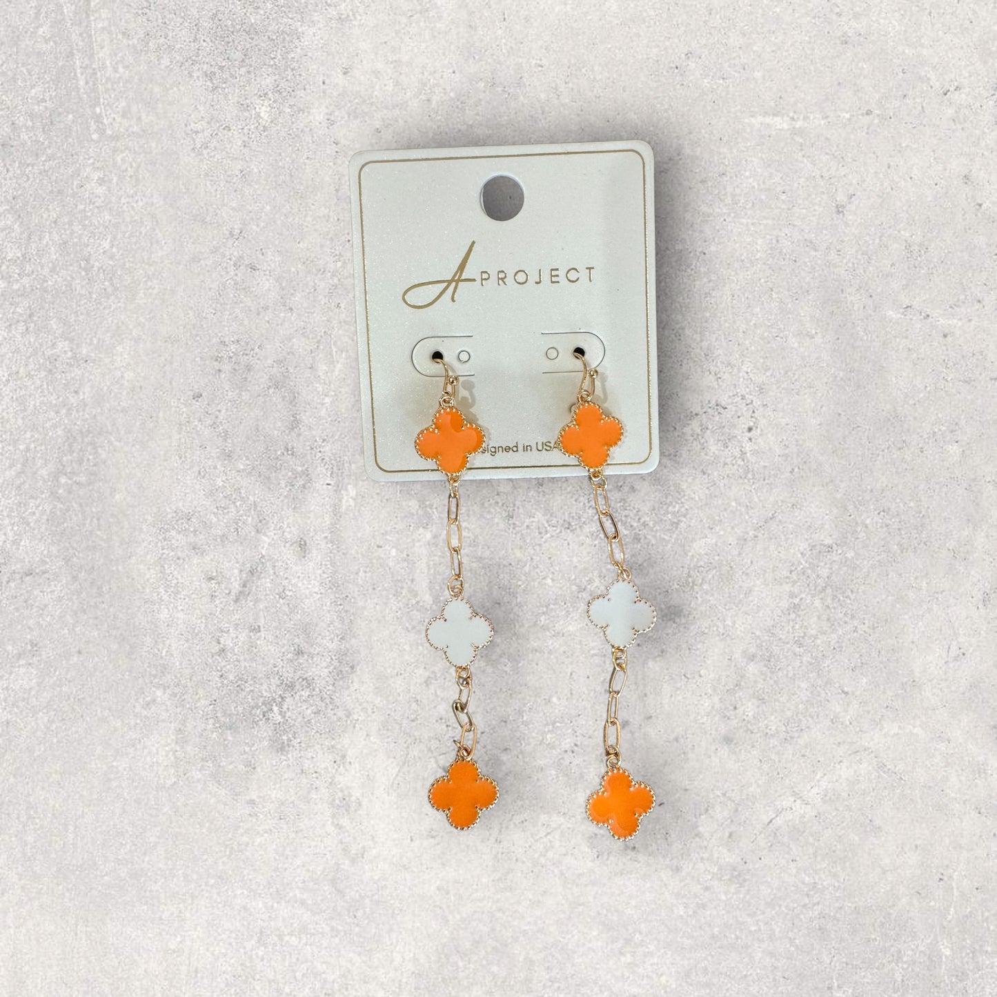 Large orange clover dangle earrings