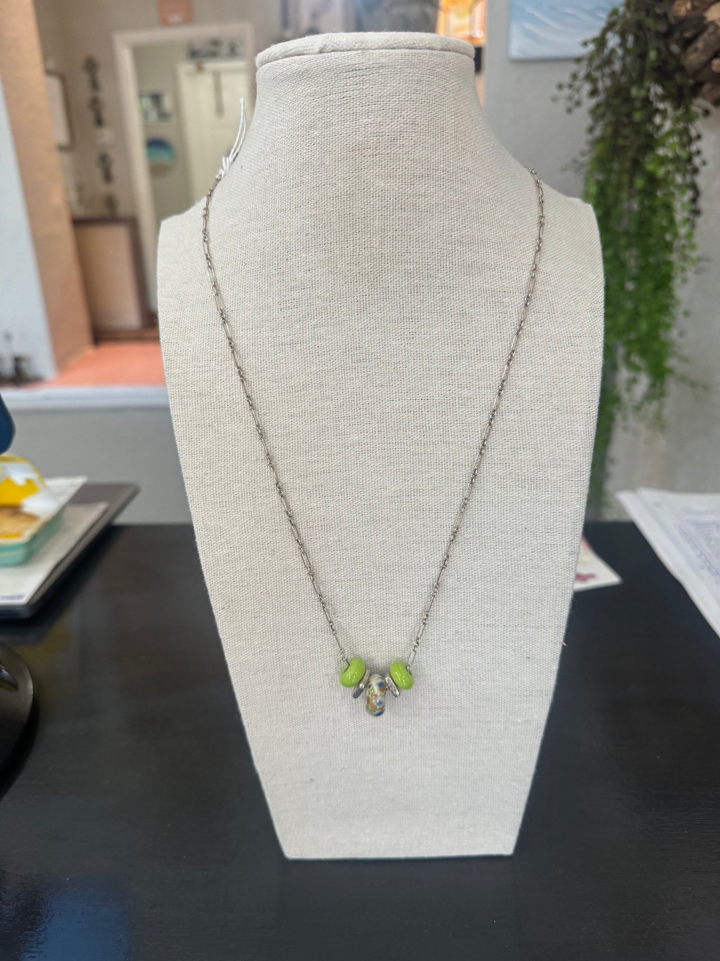 Glass bead necklace with green beads